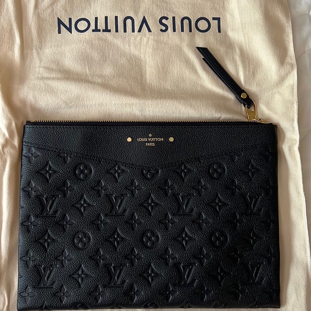 Slightly used LV black leather pouch bag